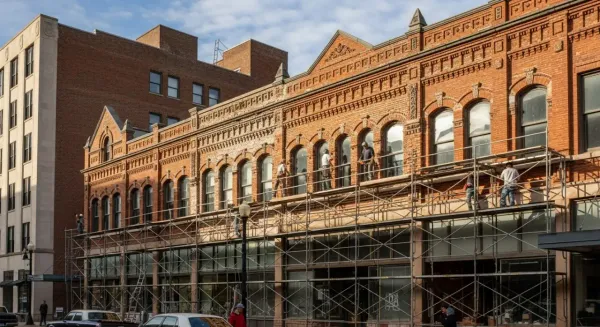 Historic masonry restoration Grand Rapids Michigan - commercial brick building with scaffolding during restoration downtown